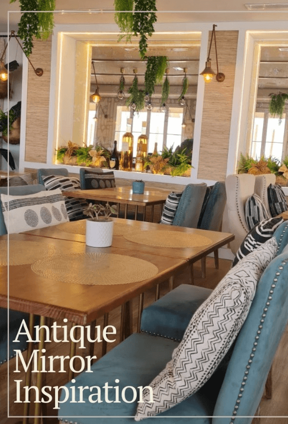 Antique Mirror In A Restaurant Restaurant Dining Area With Wooden Table, Upholstered Chairs, And Antique Mirror Wall.
