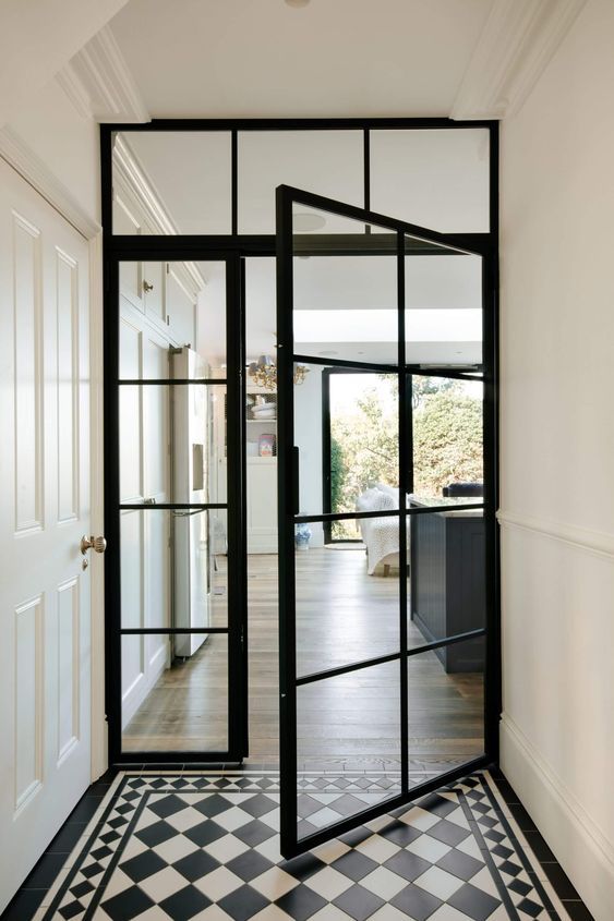 Crittal Style Partition Incorporating A Door Critical Style Partition Incorporating A Door With Grid-Framed Glass Panels.