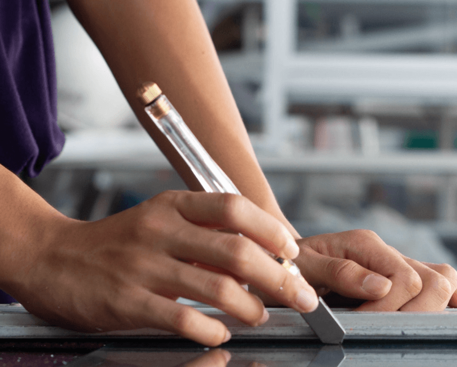 Skilled Worker From Northside Glass Ltd. Precisely Cutting Glass With A Scoring Tool For A Bespoke Project In Cork, Ireland.