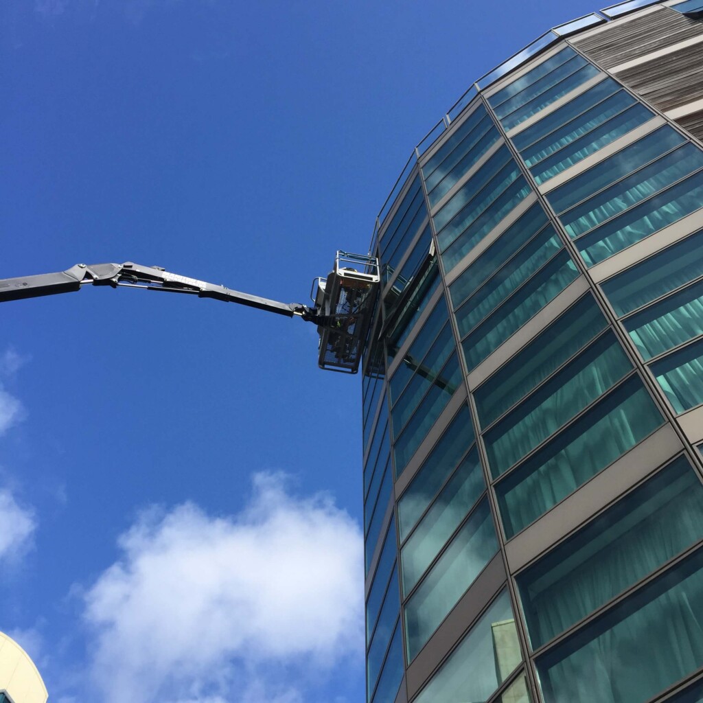Insulated Glass Unit Install Northside Glass Ltd. Installing Large Insulated Glass Units (Igu) On A Modern Commercial Building Facade In Cork, Ireland, Using A Crane.