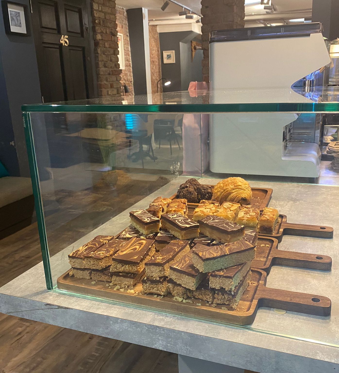 All Glass Display Case Custom All-Glass Display Case Showcasing Baked Goods In A Cafe Setting, Fabricated By Northside Glass Ltd. In Cork, Ireland.