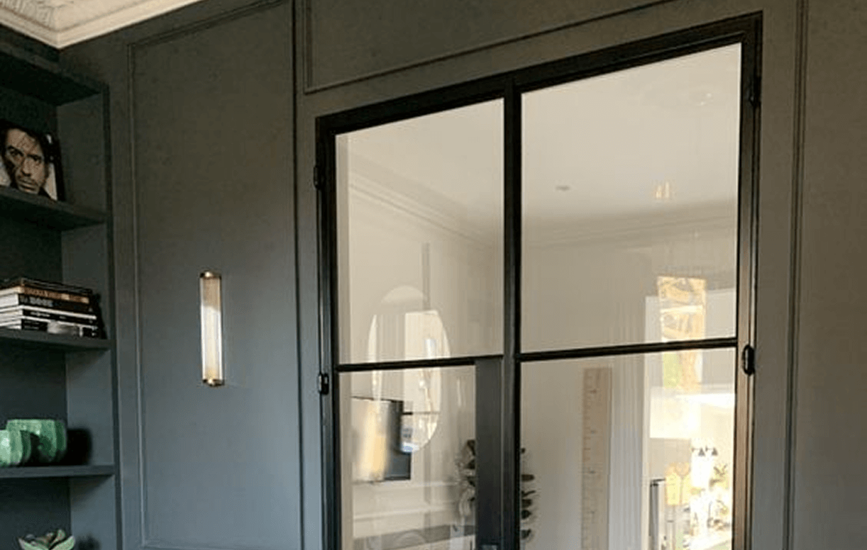 Crittal Style Glass With Black Divisions Critical Style Glass Partition With Black Grid Divisions In A Modern Interior.