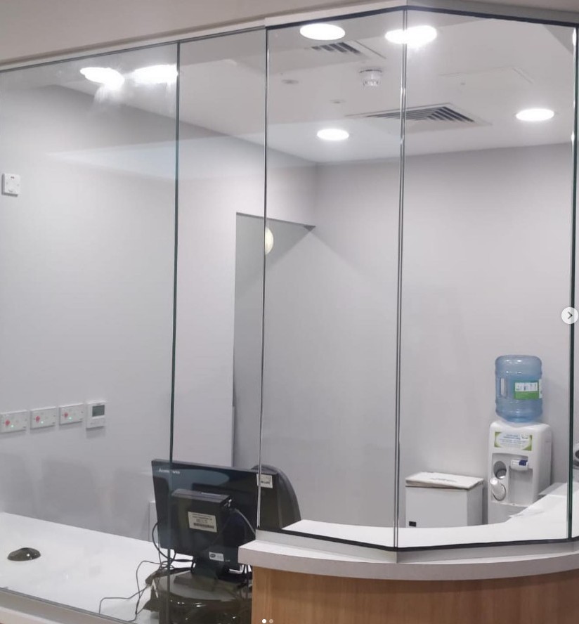 Reception Desk With Full-Height Fixed Glass Screen And Office Setup
