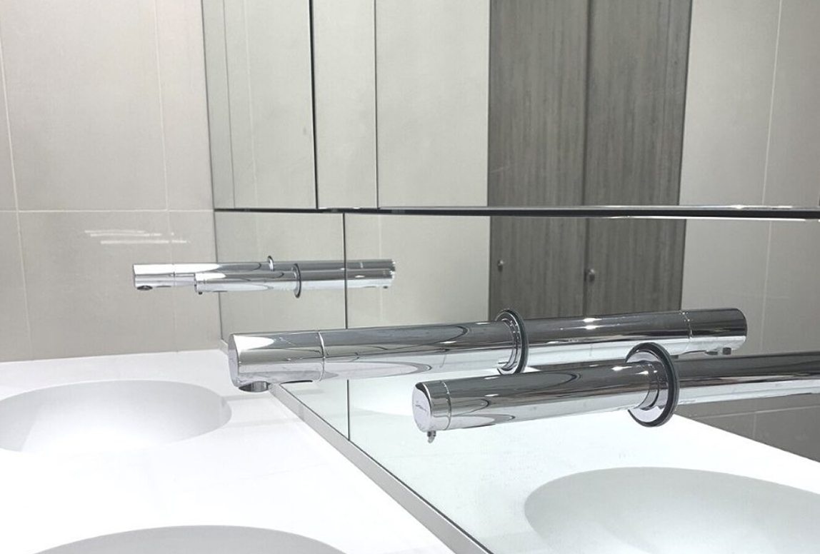 Silver Mirror Cladding In Bathroom Bathroom With Silver Mirror Cladding Above Double Sinks