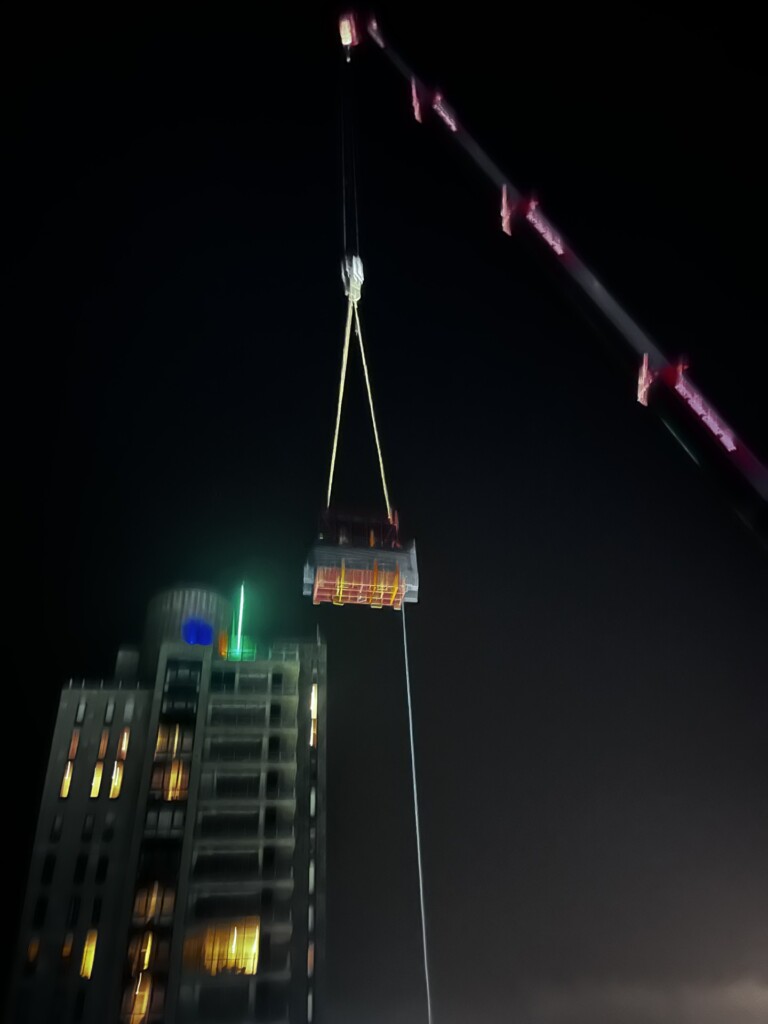 Crane Lifting A Stillage Full Of Double Glazed Units In Cork City . Demonstratig Difficult Acess Issues By Nsg
